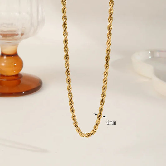 Close-up of a 4mm gold-plated twisted rope chain necklace showing its textured weave and 4mm width measurement.
