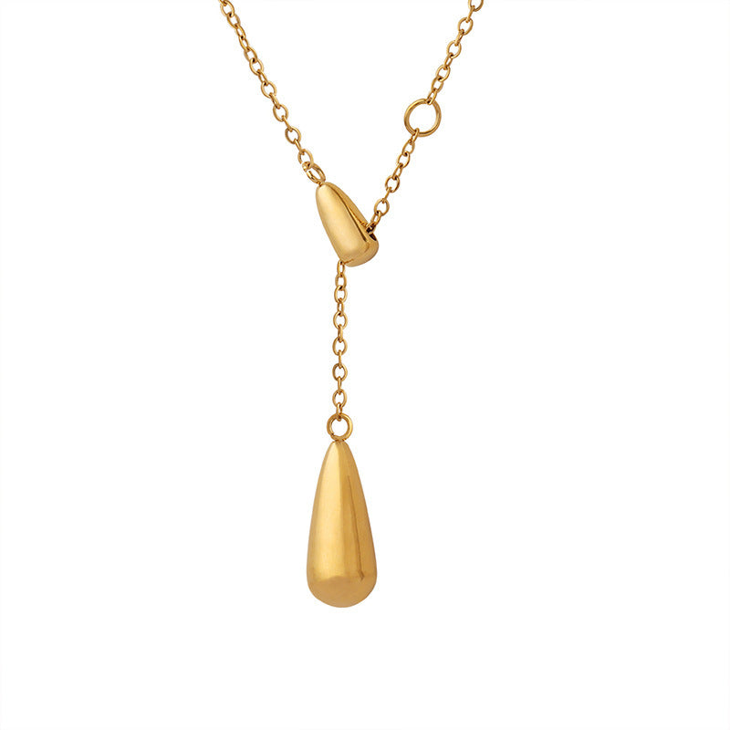 Clean product shot of the titanium steel gold necklace isolated on a white background.