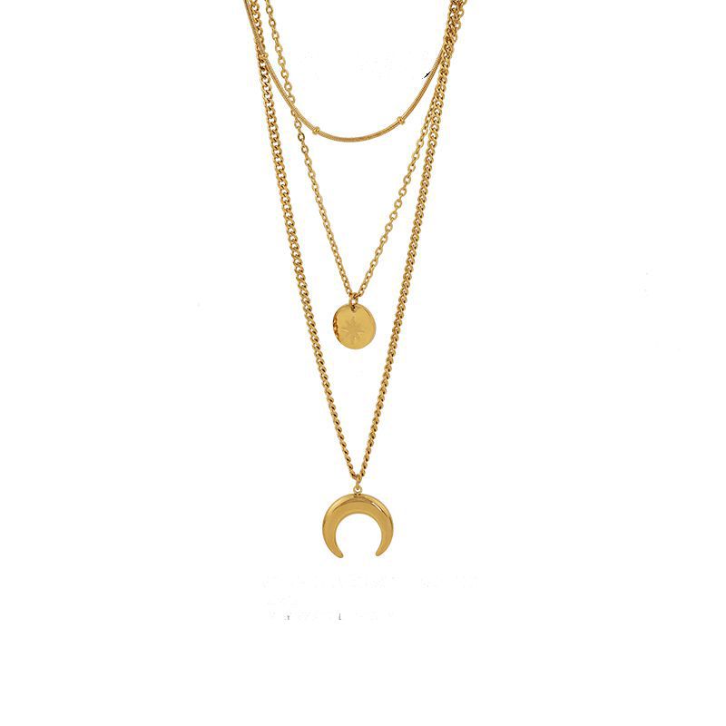 High-quality product shot of the triple-layer gold celestial necklace isolated on a white background.