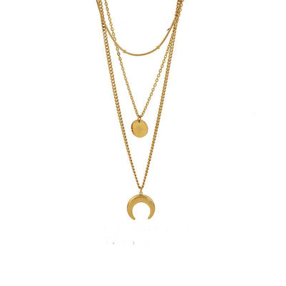 High-quality product shot of the triple-layer gold celestial necklace isolated on a white background.