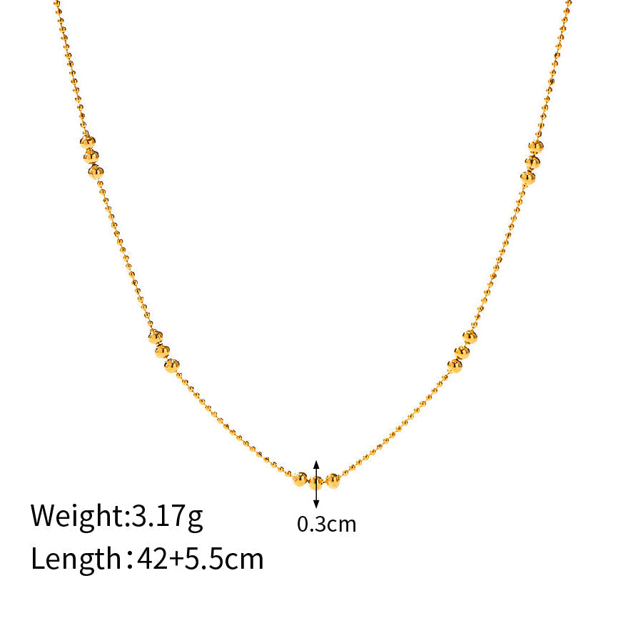 Product measurement diagram showing the 42cm chain length, 5.5cm extender, and 0.3cm bead cluster width.