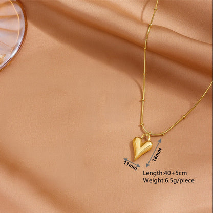 Technical diagram of the heart necklace, showing dimensions: 11x18 mm pendant and 40+5cm length.