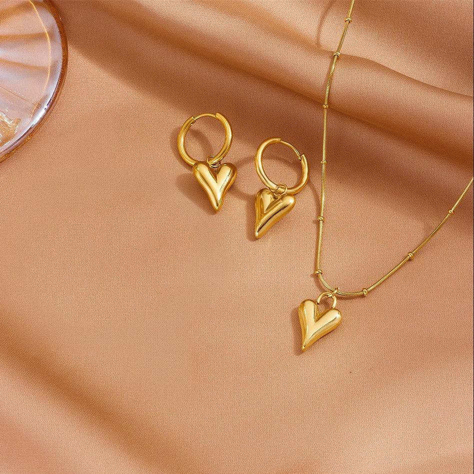 The complete 18K gold plated jewelry set featuring the heart necklace and matching drop hoop earrings.