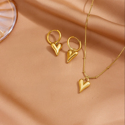 The complete 18K gold plated jewelry set featuring the heart necklace and matching drop hoop earrings.